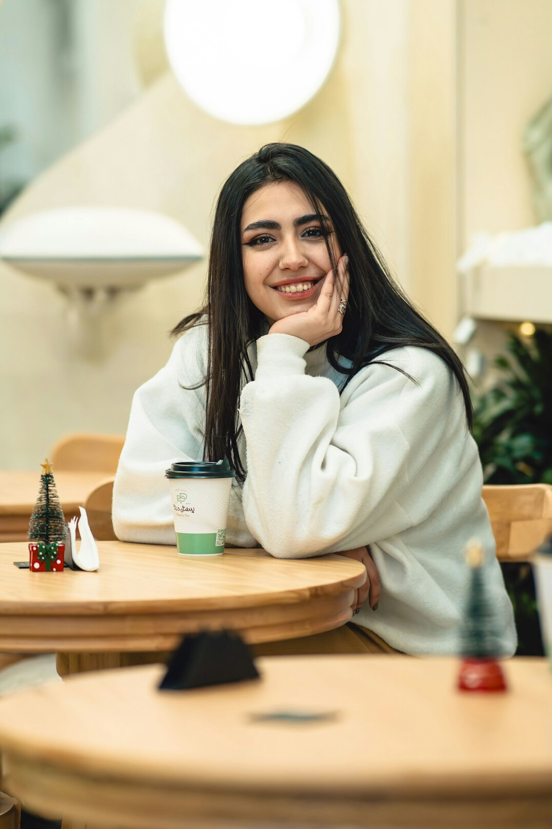 woman drinking coffee in cafe